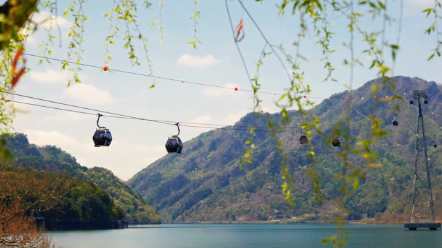 Cable cars over a scenic mountain lake