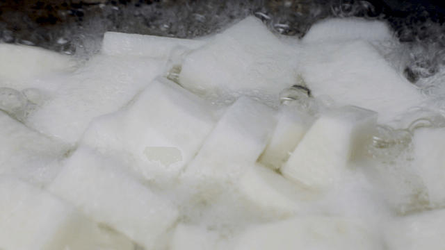 Boiling white radish in a pot