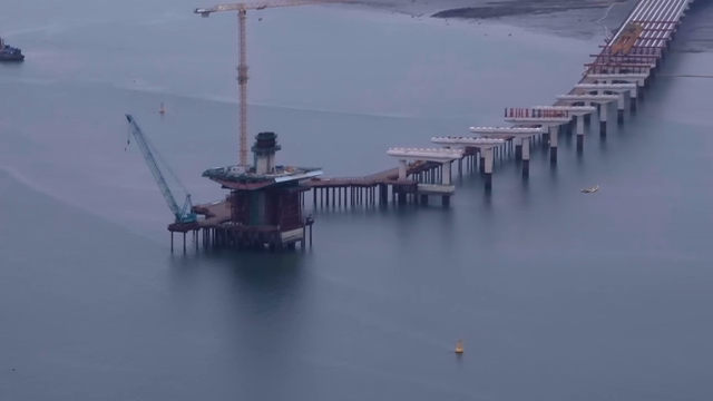 Bridge construction over calm waters