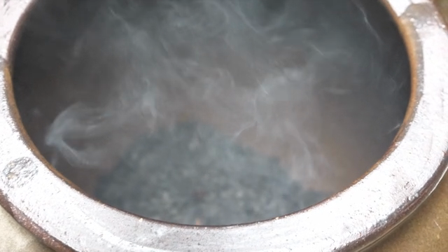 Steam rising from a traditional pot