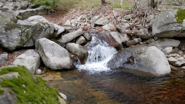 A small waterfall flowing over rocks