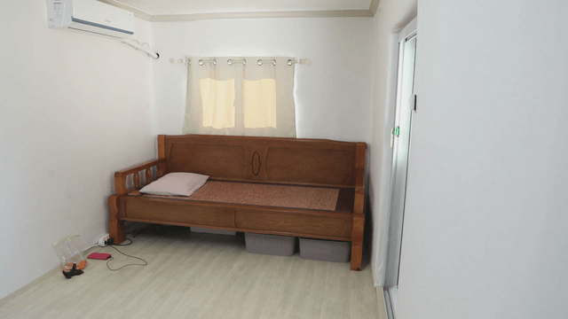 Simple room with a wooden sofa