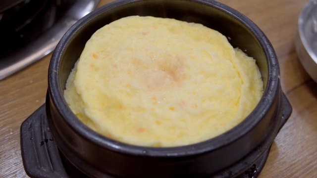 Steamed egg in a hot stone pot