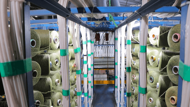 Green yarn bundles in factory