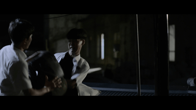 Two students in a nighttime confrontation