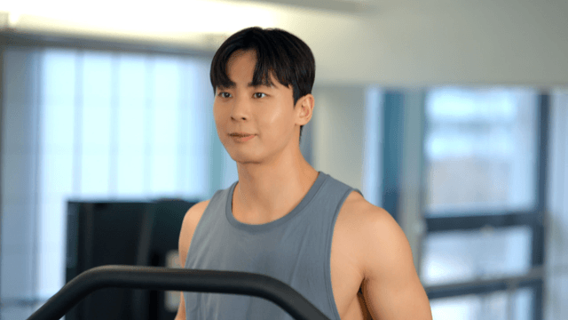 Man jogging on a treadmill at gym