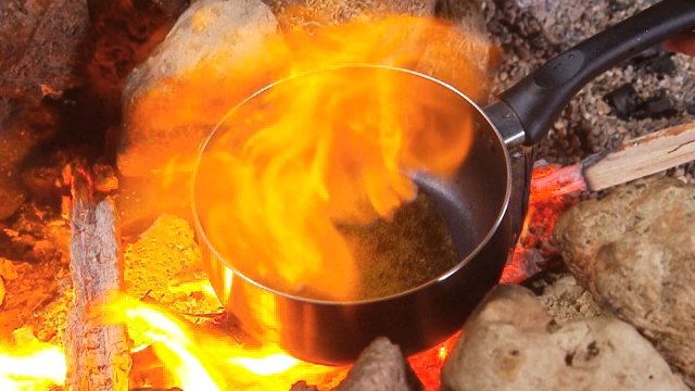 Cooking over an open flame outdoors