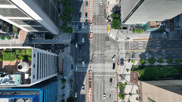 A bustling city intersection with traffic