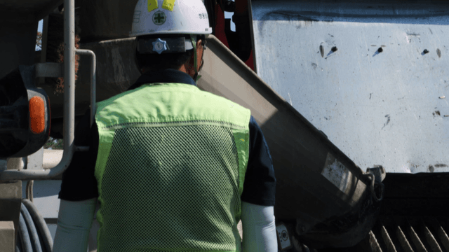 Construction worker operating machinery