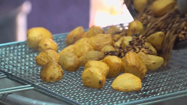 Roasted garlic and rice being poured