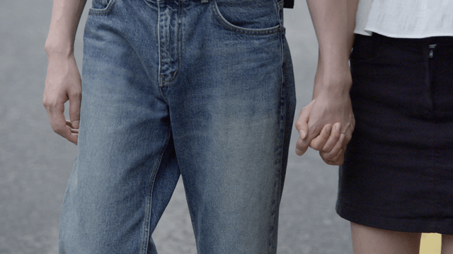 Couple letting go of hands while walking
