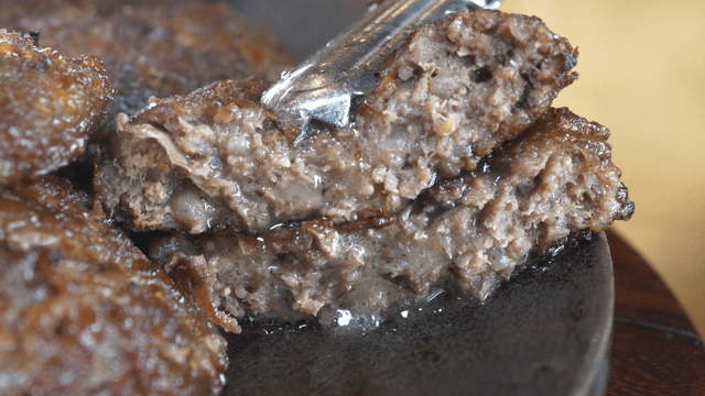 Juicy grilled short rib patty served on a plate
