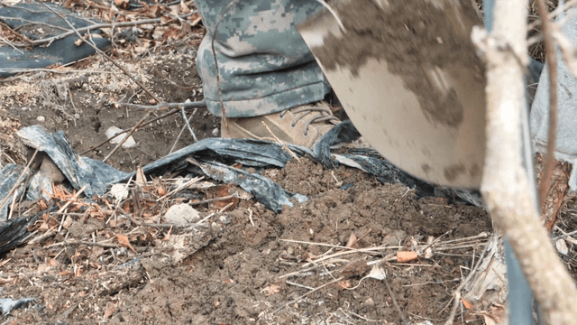 Shovel digging into the soil