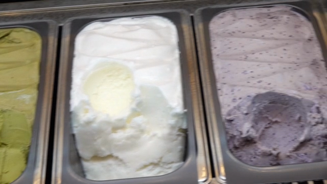 Various flavors of ice cream in trays