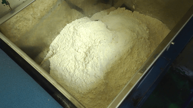 Pouring flour into a machine