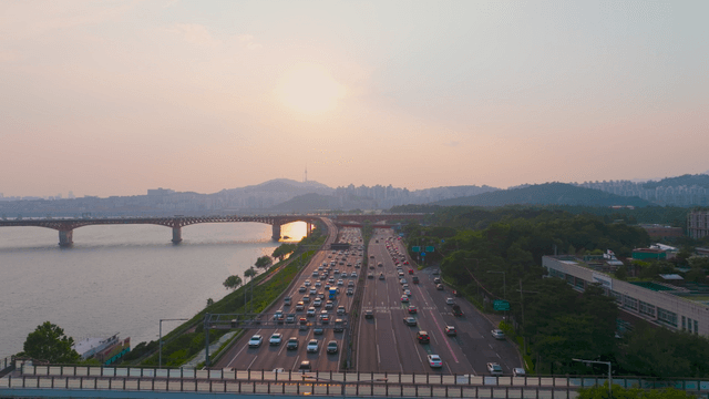 Busy highway along the Han River at sunset