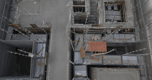 Construction site with scaffolding and concrete