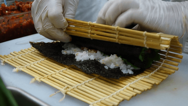 Rolling kimbap with seaweed and rice
