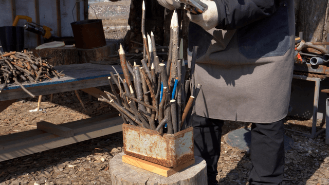 Wooden pencil carvings arranged in a metal container