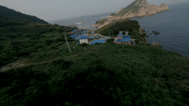 Coastal village surrounded by mountains