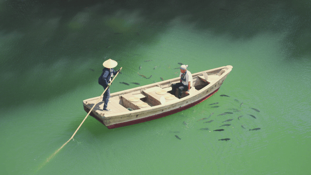 Boatman and passenger on a calm river