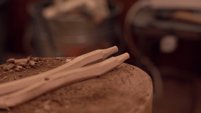 Wooden tool on a workbench with shavings