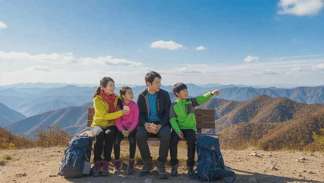 Family enjoying the view from a mountain bench