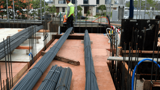 Construction site with rebar and tools