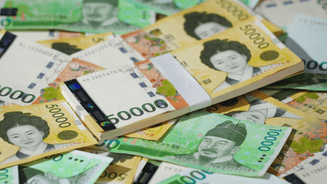 Various Korean banknotes scattered