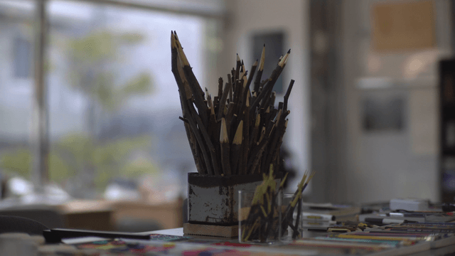 Wooden branch pencil sculpture on art activity table