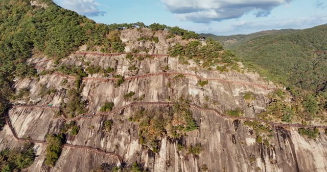 A scenic mountain with a winding path