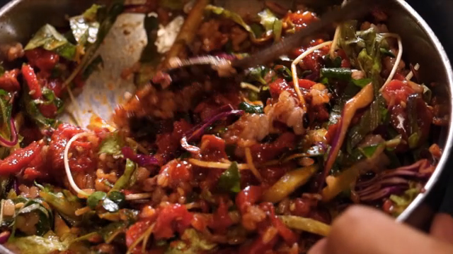 Preparing a bowl of Korean yukhoe bibimbap