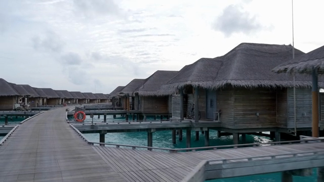 Overwater bungalows on a serene ocean