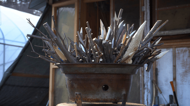 Fire pit filled with pointed wooden sticks