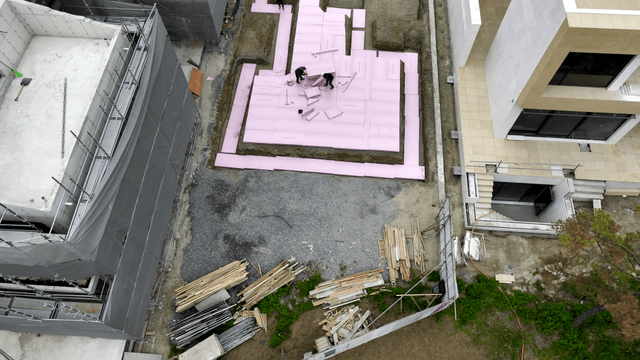 Construction site with workers and materials