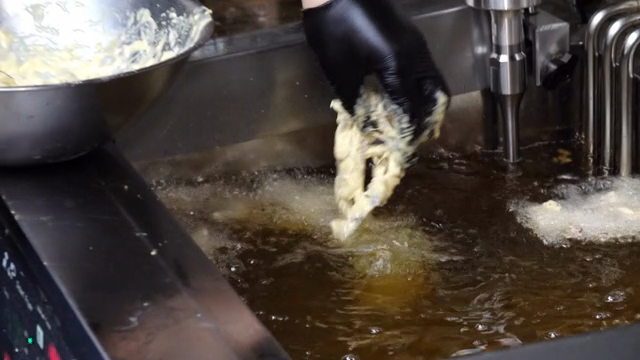 Batter being fried in hot oil