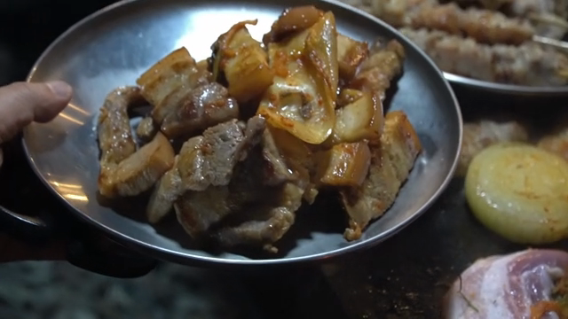 Grilled pork belly with kimchi on a plate