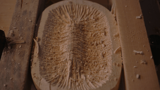 Wood carving process using chisel with intricate patterns