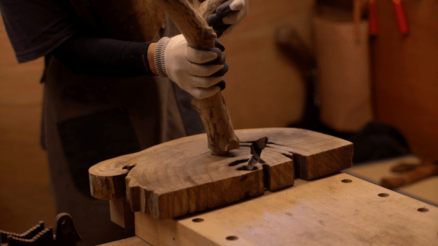 Craftsman working on a wooden piece