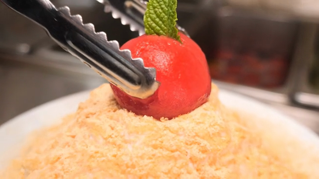 Tomato topping placed on shaved ice