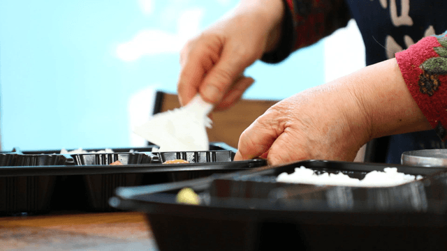 Korean lunch boxes being prepared