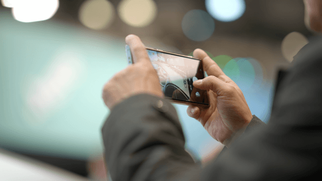 Person capturing video with smartphone