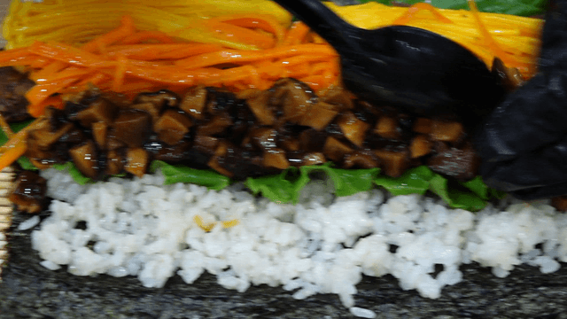 King oyster mushroom gimbap filling prepared with a spoon
