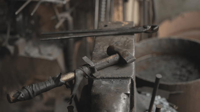 Hammer on anvil in workshop