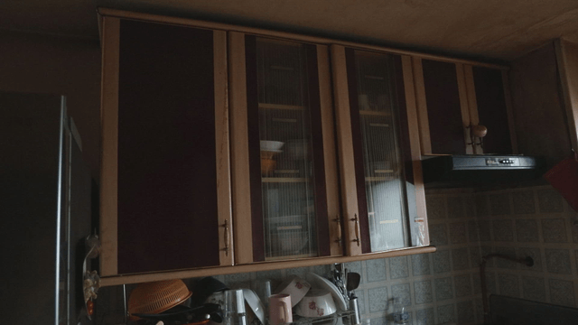 Kitchen cabinets with dishes and utensils