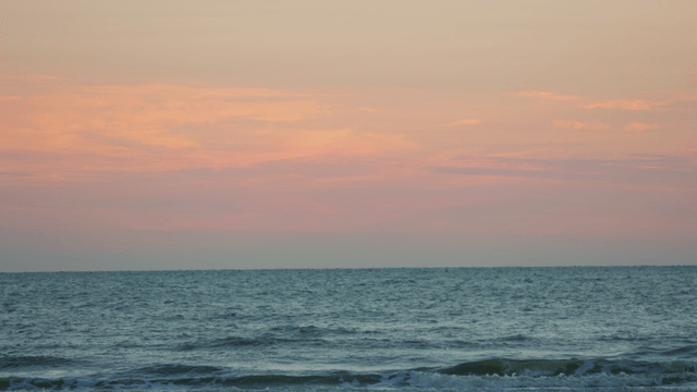 Tranquil seaside and waves at early evening