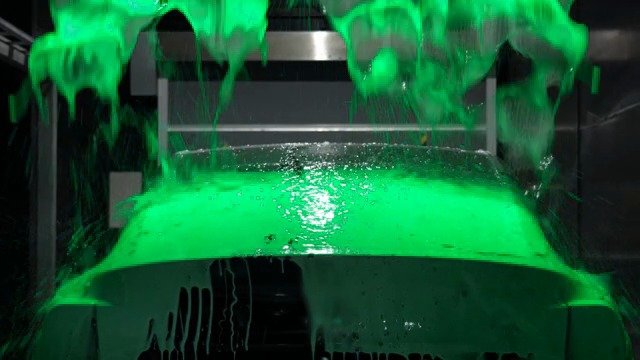 Car being washed with colorful soap
