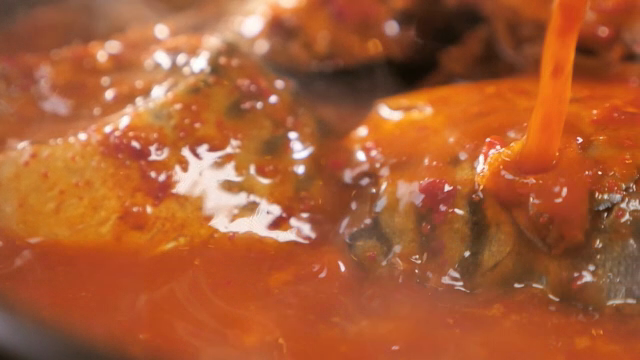 Simmering stew with rich sauce and vegetables