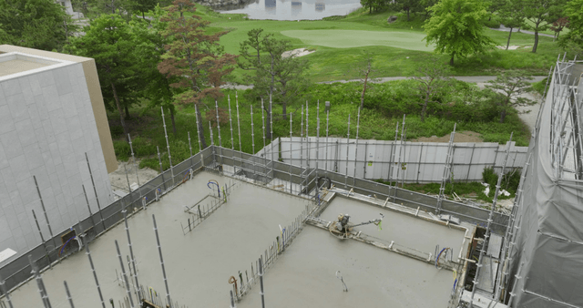 Building under construction near a golf course