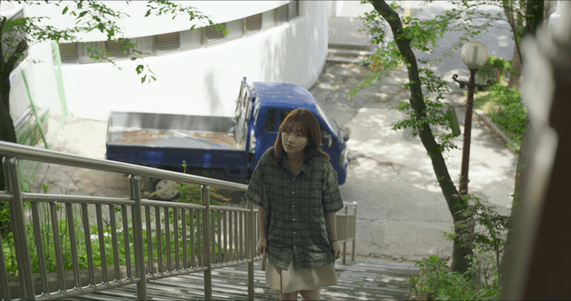 Woman walking up outdoor stairs